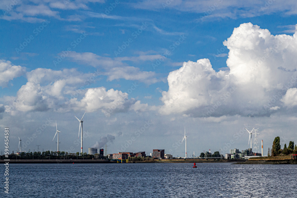 Wind turbines along the Scheldt river, Antwerp, Belgium.