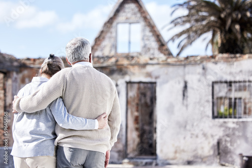 Raw heartbreak. Shot of a senior couple comforting each other after losing their home to a fire. © Alexis Scholtz/peopleimages.com