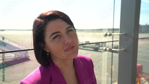 A beautiful woman in a close-up shot, filmed in slow motion by a camera photo