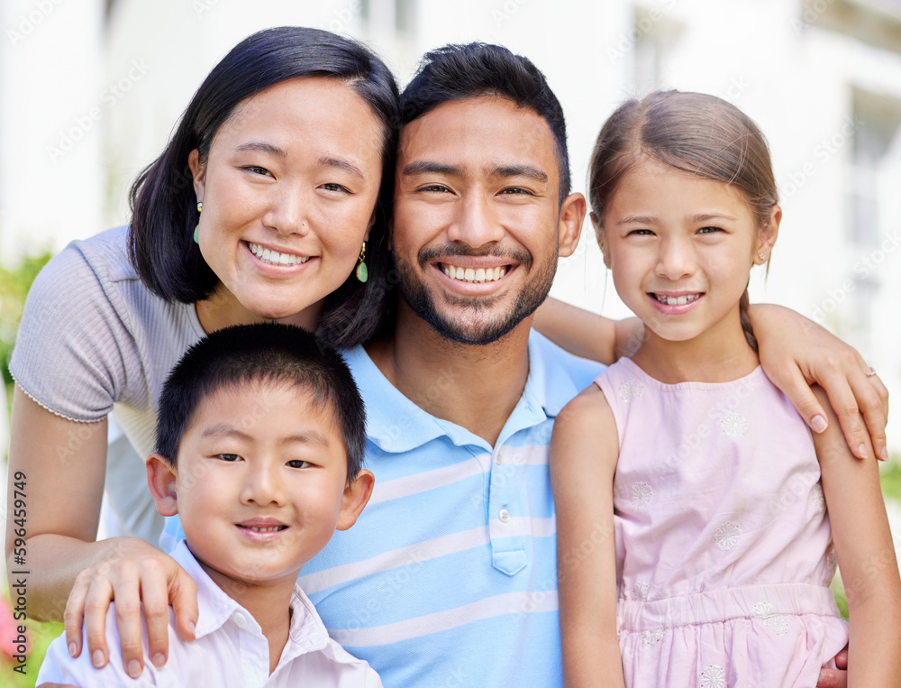 This is our family. Shot of a young family spending time together in their garden at home. This is our family. Shot of a young family spending time together in their garden at home.
