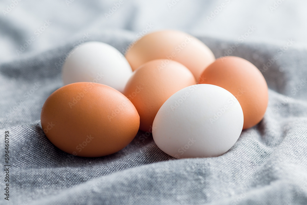 Whole chicken eggs on kitchen napkin. Whole chicken eggs on kitchen napkin.