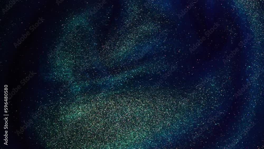 Slow-Motion Footage of Shiny Gold Dust Particles Creating Dynamic Waves and Overflows in a Blue Liquid. Wavy circular motion of sparkling gold particles in blue fluid with subtle green tint.