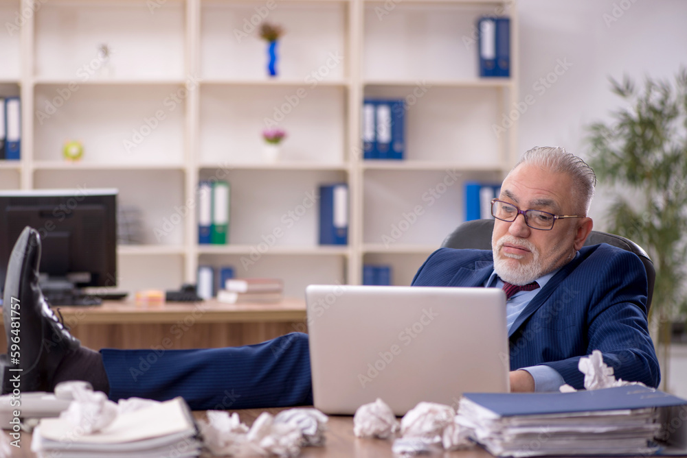 Old male employee in brainstorming concept Old male employee in brainstorming concept