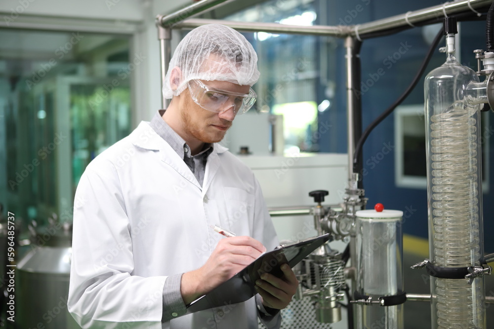 scientist analyzing a biological and ecological hemp plant used for herbal pharmaceutical CBD oil and THC oil in a laboratory. scientist analyzing a biological and ecological hemp plant used for herbal pharmaceutical CBD oil and THC oil in a laboratory.