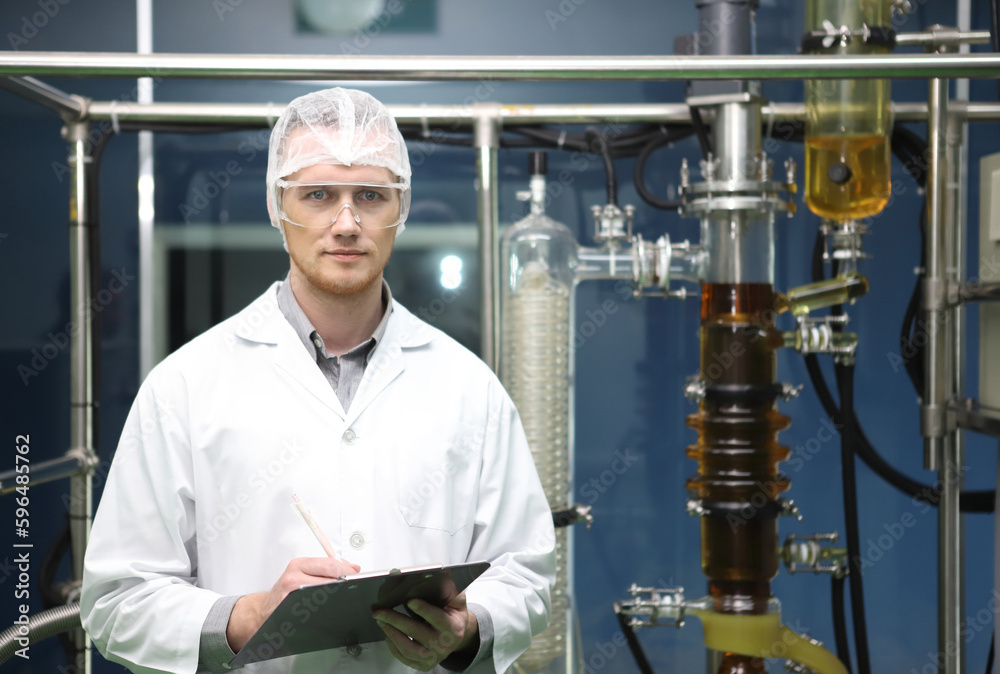 scientist analyzing a biological and ecological hemp plant used for herbal pharmaceutical CBD oil and THC oil in a laboratory. scientist analyzing a biological and ecological hemp plant used for herbal pharmaceutical CBD oil and THC oil in a laboratory.