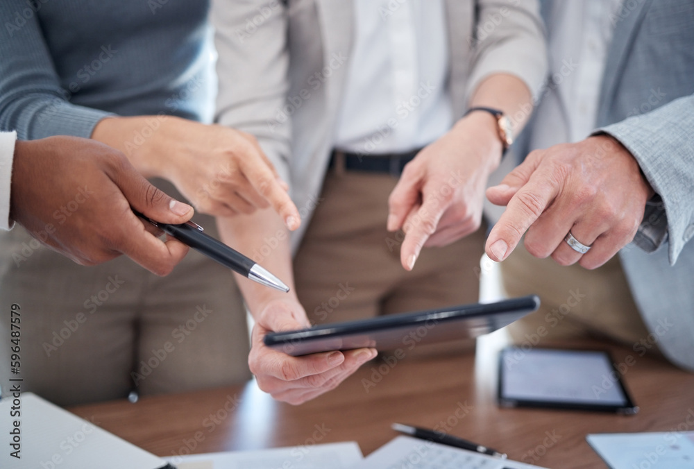 They have so many questions. Cropped shot of a group of unrecognizable businesspeople looking over a tablet in the boardroom. They have so many questions. Cropped shot of a group of unrecognizable businesspeople looking over a tablet in the boardroom.