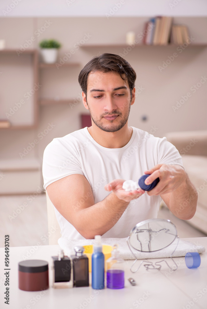 Young man shaving face at home Young man shaving face at home