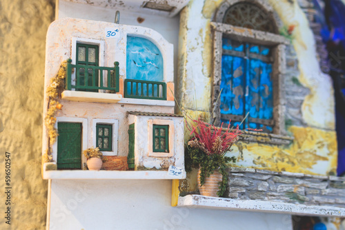 View of traditional tourist souvenirs and gifts from Athens, Attica, Greece with fridge magnets with text "Greece", "Athens" and key ring keychain, in a local vendor shop 