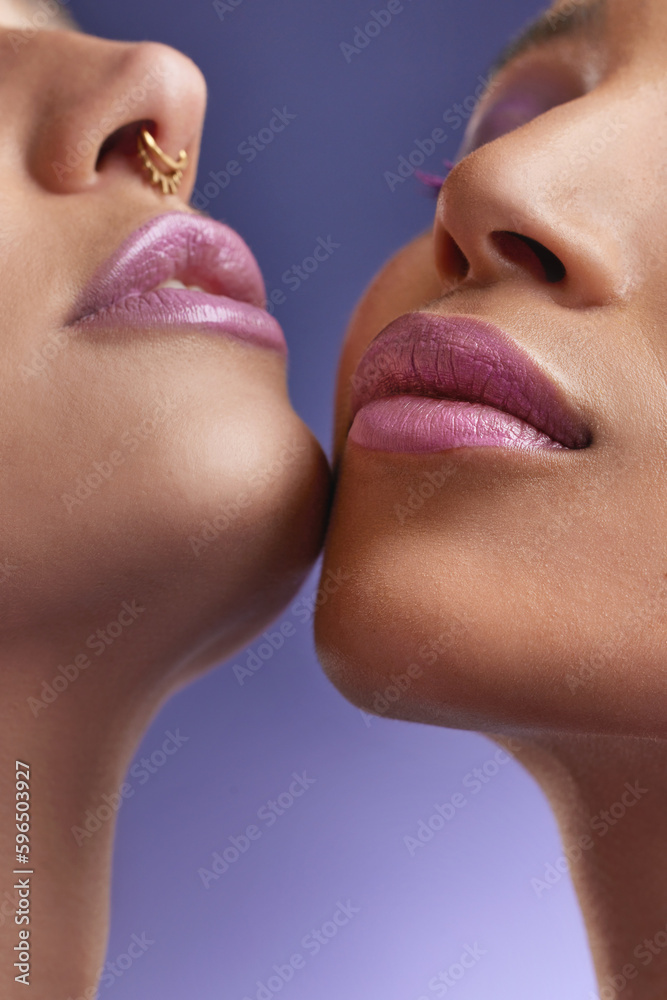 Obraz premium Purple is oh so satisfying. Cropped shot of two young women wearing purple make-up.