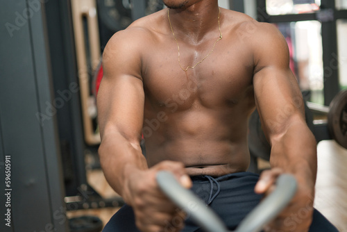 A Young African male Chasing Vitality Through Weight Training.
