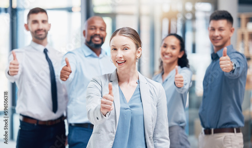We guarantee great service. Shot of a group of businesspeople showing a thumbs up in an office at work.