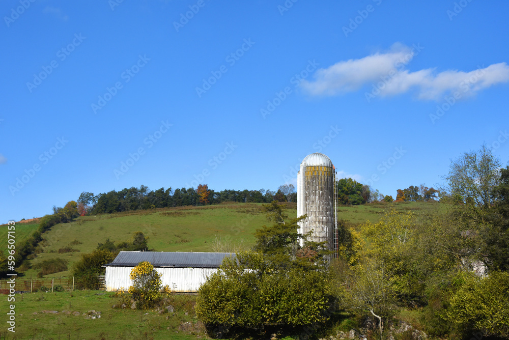Farm With Silo and White Barn