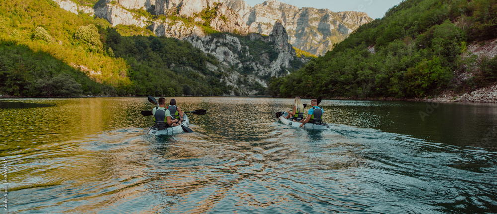 A group of friends enjoying having fun and kayaking while exploring the calm river, surrounding forest and large natural river canyons A group of friends enjoying having fun and kayaking while exploring the calm river, surrounding forest and large natural river canyons