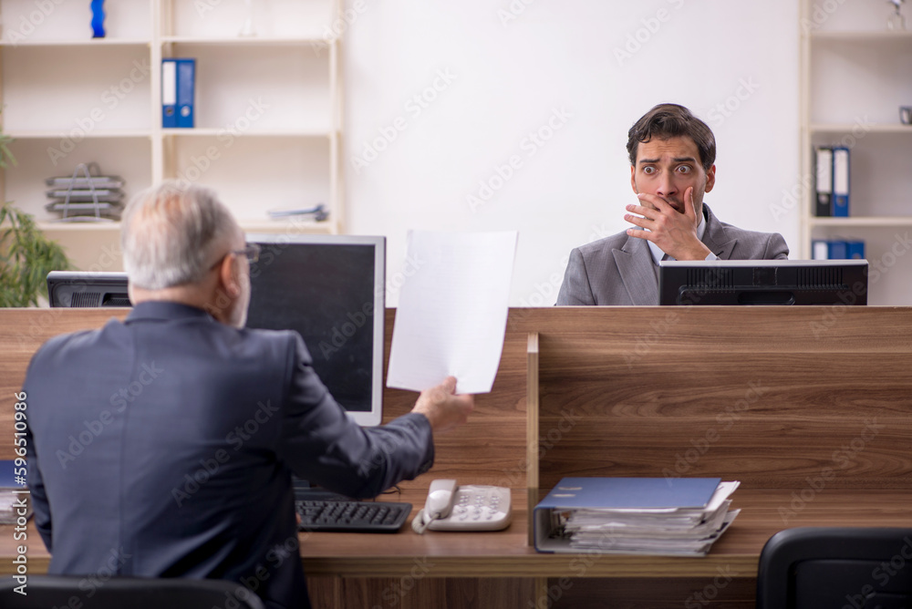 Two male colleagues working in the office Two male colleagues working in the office