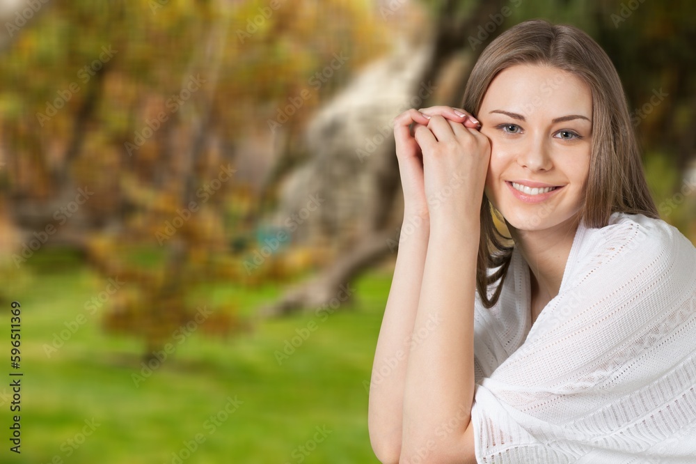 Happy Woman posing on nature background Happy Woman posing on nature background