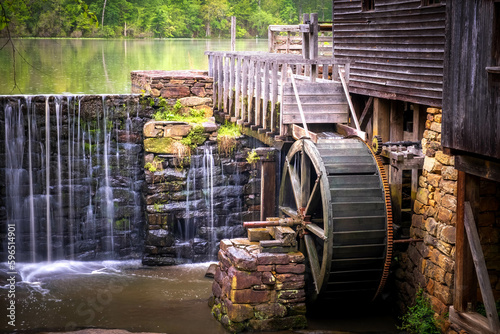 Obraz na plátne View of the millpond, waerfall, flume, and waterwheel at Historic Yates Mill County Park in Raleigh, North Carolina