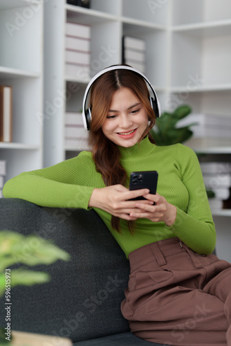 Attractive Asian woman resting comfortable living room and using mobile phone, Relax, Sofa, Lifestyle