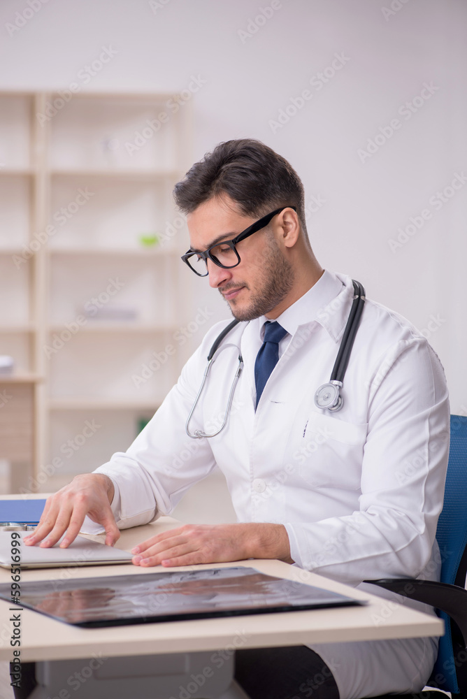 Young male doctor in telemedicine concept Young male doctor in telemedicine concept