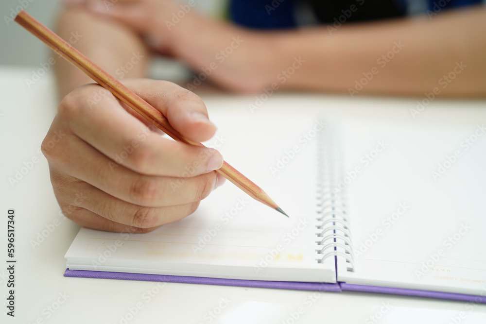 Asian teenage student write homework, study lesson for exam online learning education. Asian teenage student write homework, study lesson for exam online learning education.