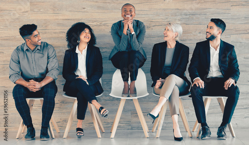 Nothing worthwhile comes easily. Shot of a group of businesspeople sitting in a row in an office at work.