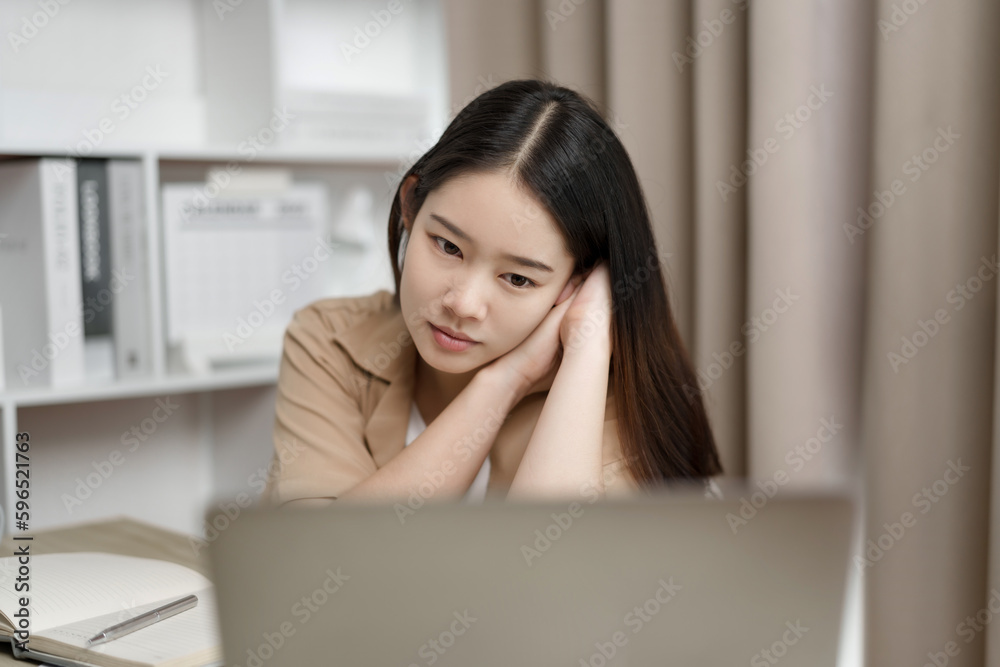 Young asian online tutor with laptop for video call to her students at home. Young asian online tutor with laptop for video call to her students at home.