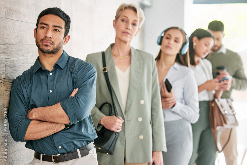 This line is barely moving. Shot of a diverse group of businesspeople standing in a line and waiting. This line is barely moving. Shot of a diverse group of businesspeople standing in a line and waiting.