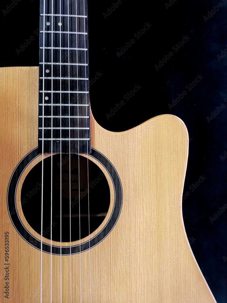 Fototapeta premium close up shot of guitar sound hole , with cedar wood top.