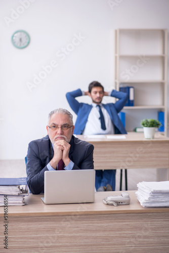 Two male colleagues working in the office