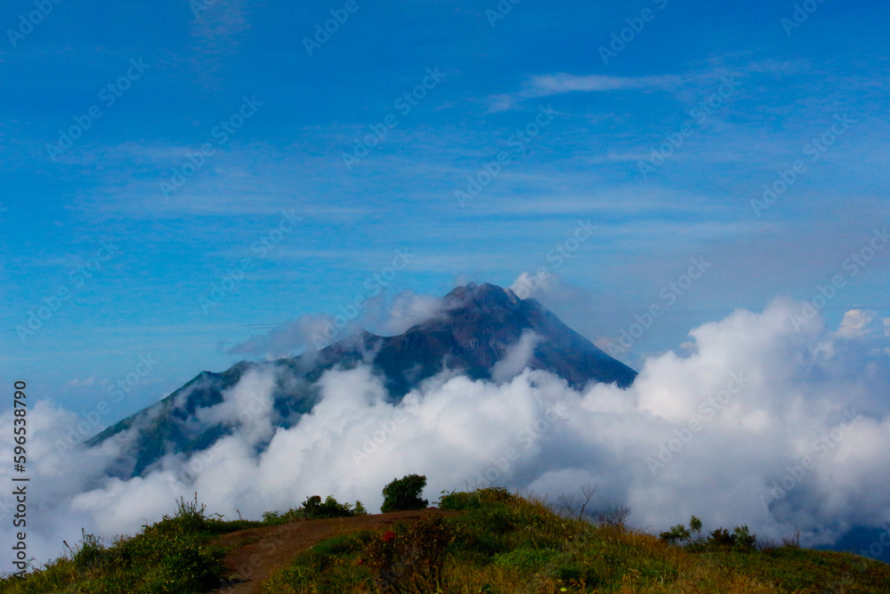 photo of a hill covered in clouds on Mount Merbabu, Indonesia