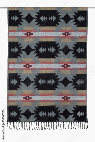 Textile background from a woolen scarf, tippet, with a geometric pattern, close-up, studio shot.