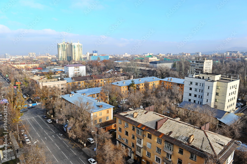 Almaty, Kazakhstan - 11.23.2015 : The roadway of the street along a multi-storey residential complex.