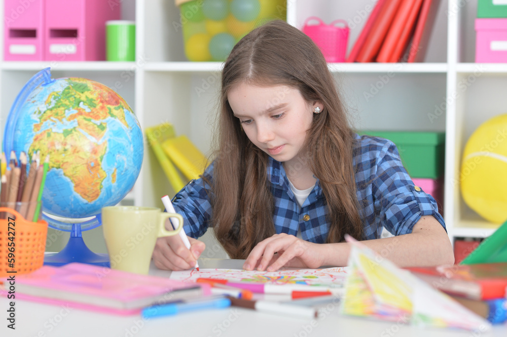 girl drawing picture at home at the table girl drawing picture at home at the table