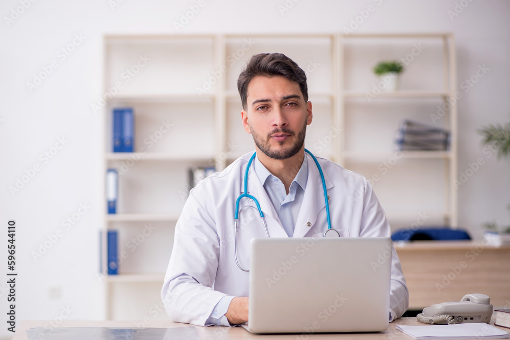 Young male doctor in telemedicine concept Young male doctor in telemedicine concept