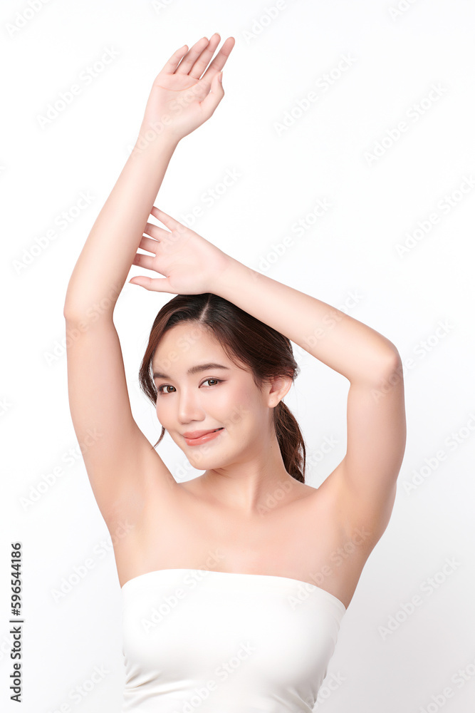 Beautiful Young Asian woman lifting hands up to show off clean and hygienic armpits or underarms on white background, Smooth armpit cleanliness and protection concept Beautiful Young Asian woman lifting hands up to show off clean and hygienic armpits or underarms on white background, Smooth armpit cleanliness and protection concept