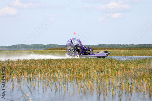 An airboat on the wetland at Lake Tohopekaliga near Orlando, Florida photo