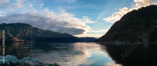 Ocean Inlet with Rocky Mountains in Canadian Landscape. Nature Background. Howe Sound, Squamish, BC, Canada. Sunset.