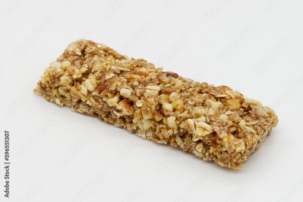 Cereal bar with apricot, apple and dried fruit on white background Cereal bar with apricot, apple and dried fruit on white background