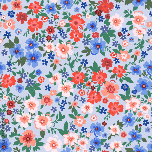 Seamless pattern. Vector flower design with cute wildflowers. Romantic abstract floral pattern on a blue background. Illustration of spring nature in bright red and blue tones.