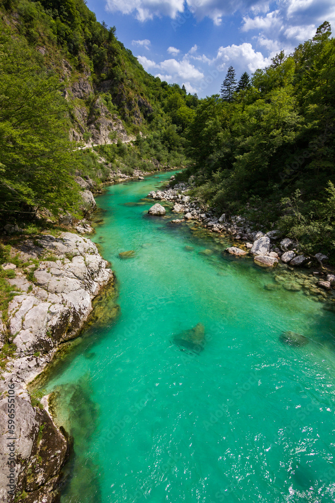 Turquoise colored soça river near Kozjak waterfall in Slovenia Turquoise colored soça river near Kozjak waterfall in Slovenia