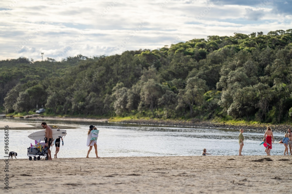family enjoy a beach holiday in summer, swimming in the sea family enjoy a beach holiday in summer, swimming in the sea