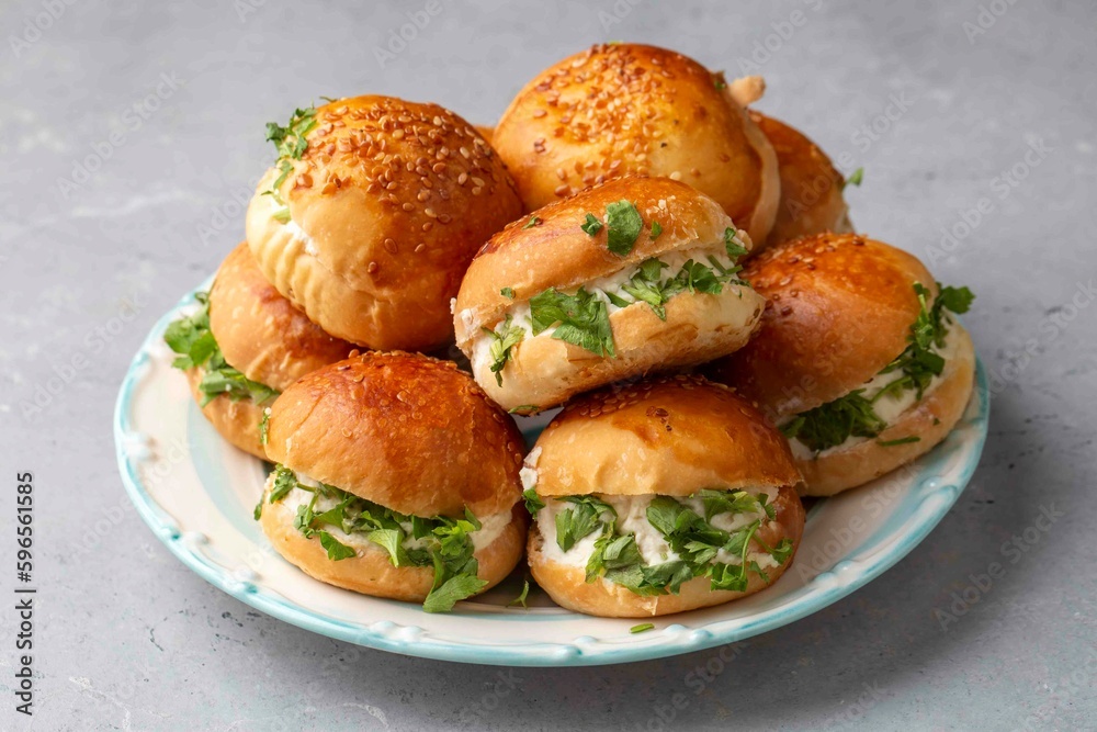 Turkish pastry filled with dill, parsley, cream cheese and cheddar cheese. Turkish name: Sakallı Pogaca or Saçaklı Pogaca