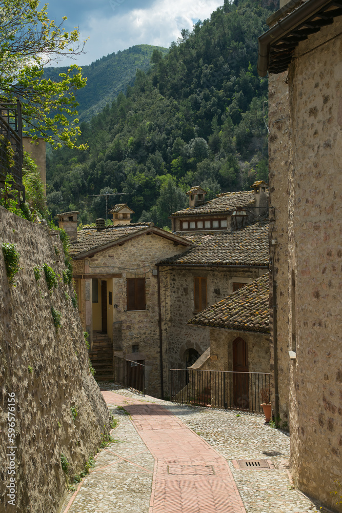 View of the center of Scheggino town in Valnerina between green mountain in Umbria, Italy