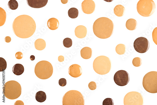 Diverse skin tone makeup foundation round drops background. Isolated, cut out.
