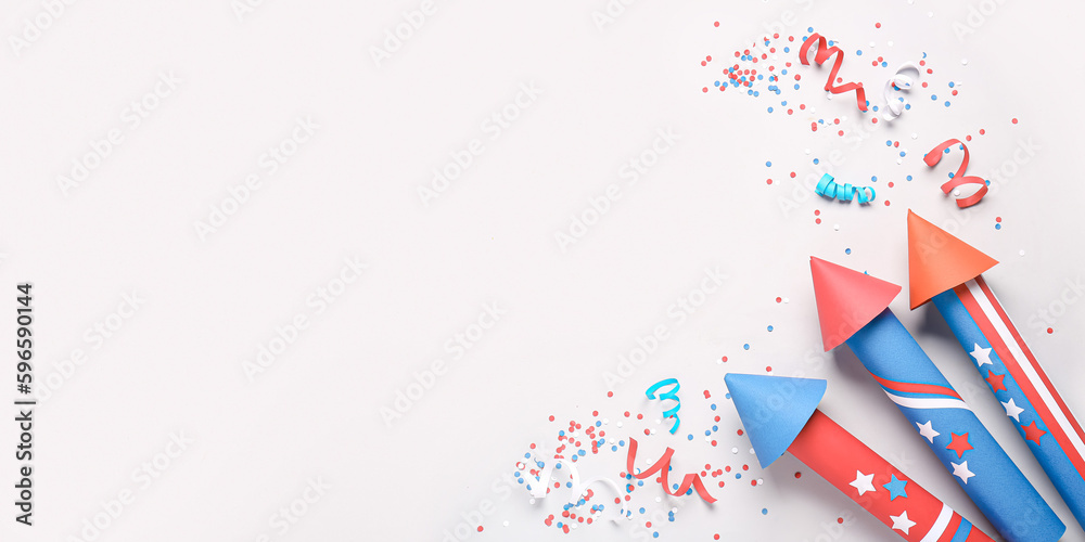 Obraz premium Firework rockets for USA Independence Day on light background with space for text