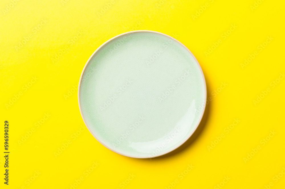 Top view of isolated of colored background empty round blue plate for food. Empty dish with space for your design Top view of isolated of colored background empty round blue plate for food. Empty dish with space for your design