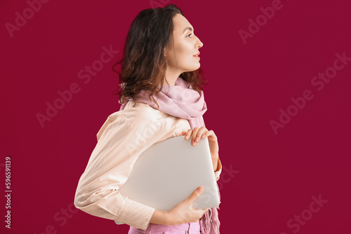 Stylish young woman in scar...