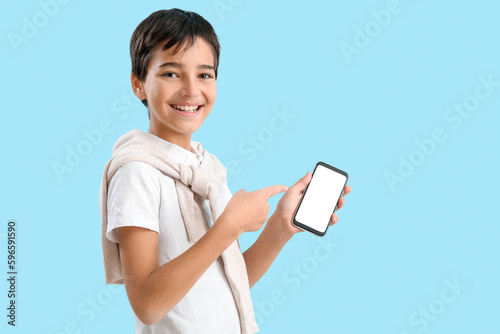 Little boy pointing at mobi...