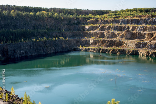 flooded quarry with blue water
