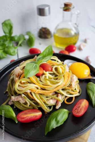 Pasta and bacon with parmesan. Homemade spaghetti pasta. On a wooden background