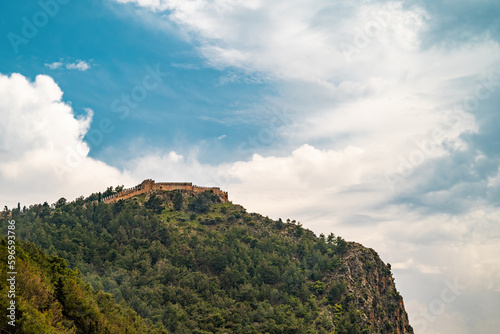 View of Alanya castle from Cleopatra beach on a sunny day